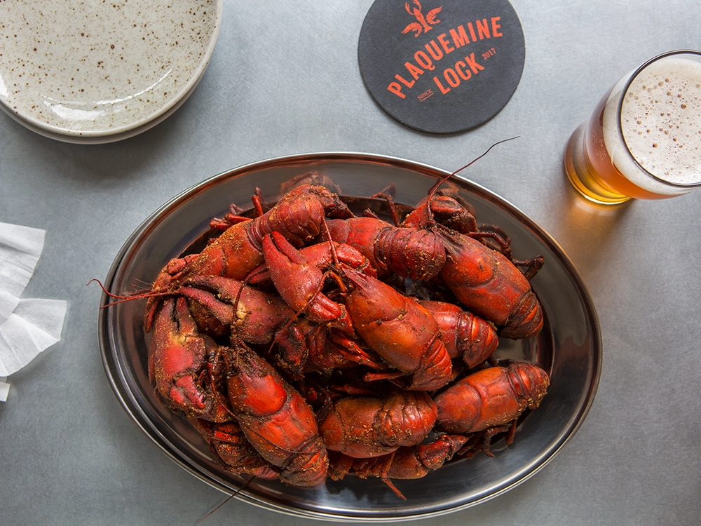 Crawfish Boil at Plaquemine Lock Islington Bowl of seasoned crawfish with beer at Plaquemine Lock pub in Islington Angel, available for private dining and group events