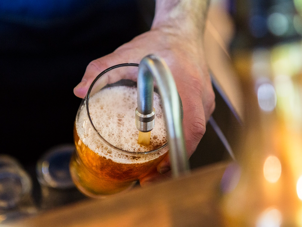 Beer Pour at Plaquemine Lock Angel London Hand pouring beer at Plaquemine Lock pub in Islington Angel, available for private hire and Christmas dining